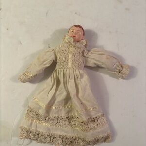 Vintage Porcelain Doll with Cream Dress